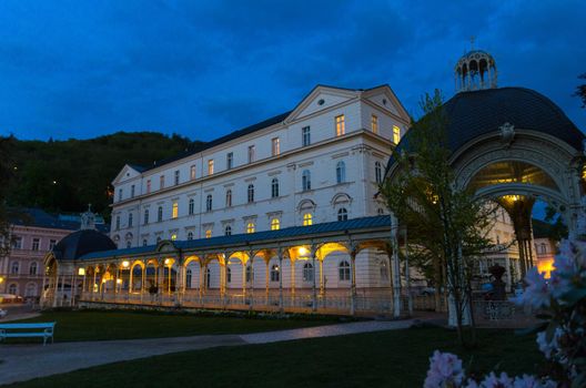 Park Colonnade with wooden arbor and lights in Dvorak Park Dvorakovy sady in Karlovy Vary Carlsbad historical city centre, evening twilight view, West Bohemia, Czech Republic