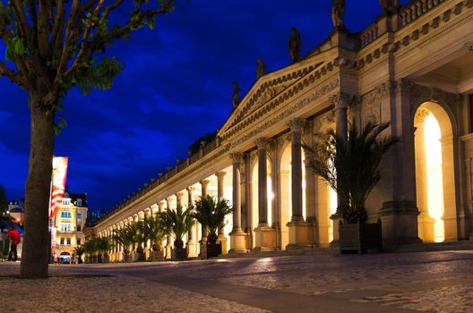 The Mill Colonnade Mlynska kolonada Neo-Renaissance building with columns and hot springs in spa town Karlovy Vary Carlsbad historical city centre, night evening view, West Bohemia, Czech Republic