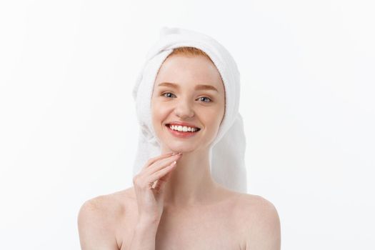 Surprised Beautiful Young Woman After Bath with A Towel On Her Head Isolated On white Background. Skin Care And Spa Theme