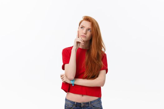 portrait of young happy woman looking and thinking over grey background