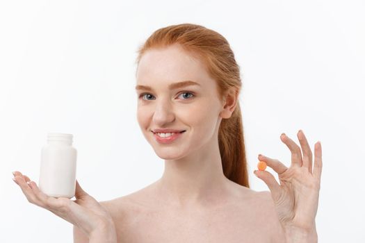 Beautiful Smiling Girl Taking Medication, Holding Bottle With Pills. Healthy Happy Female Eating Pill.Vitamins And Supplements,Diet Nutrition Concept