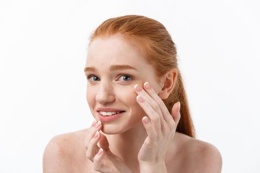 Young caucsian woman squeezes acne on the face of beauty.