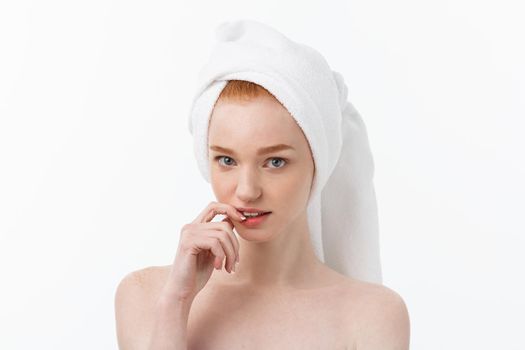 Surprised Beautiful Young Woman After Bath with A Towel On Her Head Isolated On white Background. Skin Care And Spa Theme