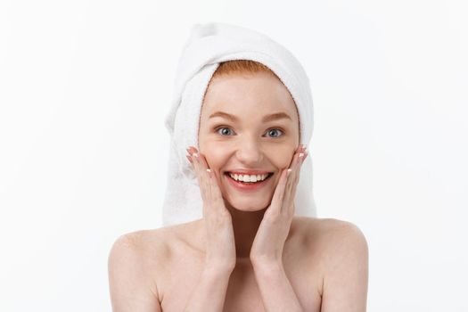 Surprised Beautiful Young Woman After Bath with A Towel On Her Head Isolated On white Background. Skin Care And Spa Theme