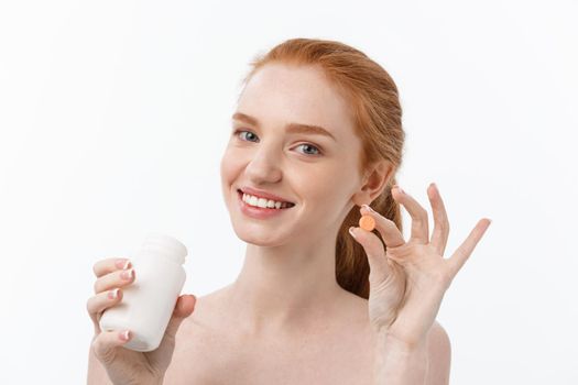 Beautiful Smiling Girl Taking Medication, Holding Bottle With Pills. Healthy Happy Female Eating Pill.Vitamins And Supplements,Diet Nutrition Concept