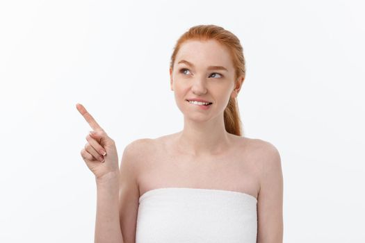 Beauty Skin care portrait of young woman showing copy space by hand