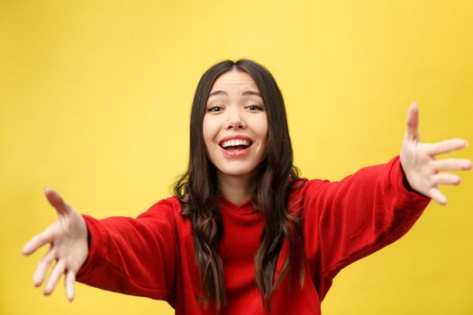 Portrait Happy Asian girl is surprised she is excited.Yellow background studio.