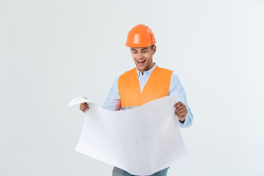 Portrait of male site contractor engineer with hard hat holding blue print paper. Isolated over white background