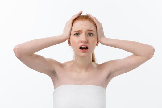 Portrait of young woman with shocked facial expression