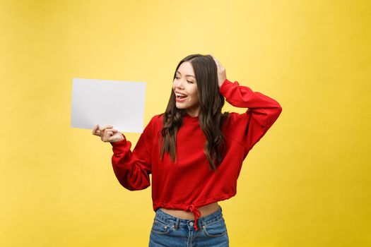 Asian young woman holding blank board or paper.