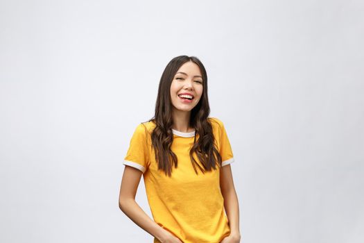 Young friendly Asian woman with smiley face isolated on white background.