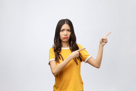 young attractive asian woman who points to the finger with unhappy emotion