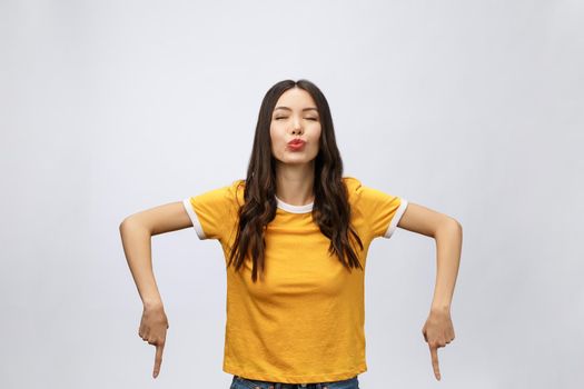 Portrait of happy young asian woman with finger point up.