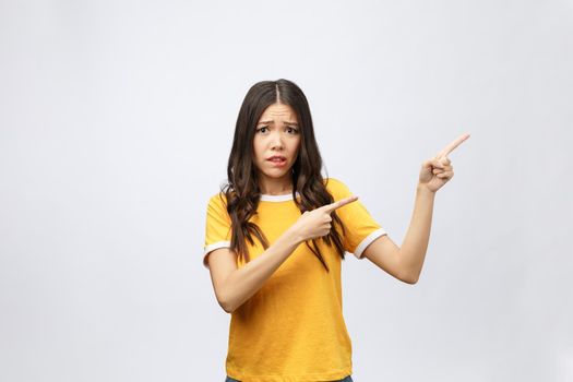 young attractive asian woman who points to the finger with unhappy emotion