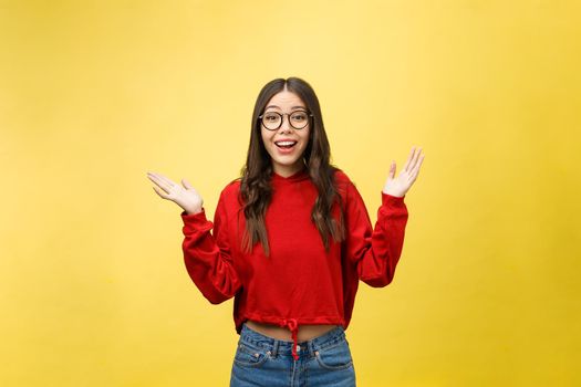 Portrait Happy Asian girl is surprised she is excited.Yellow background studio.