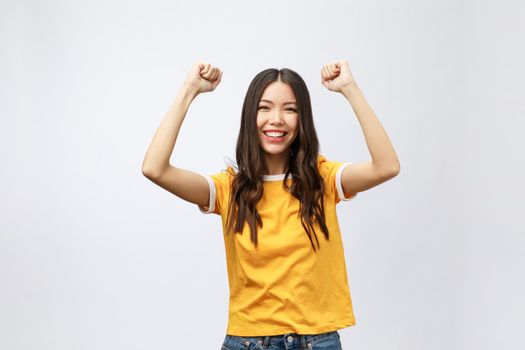 Asian women happiness hand up with winning or success something