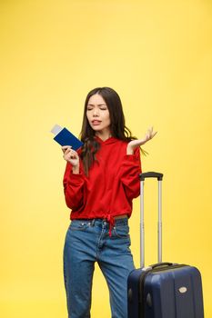 Young beautiful woman holding passport over isolated background stressed, shocked with shame and surprise face, angry and frustrated. Fear and upset for mistake