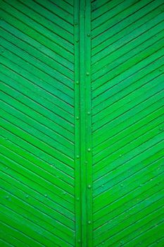 The texture of the old green board located diagonally.