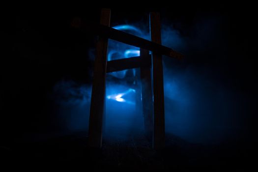 Creative artwork decoration. Abstract Japanese style wooden tunnel at night. Night scene in fantasy forest. Selective focus