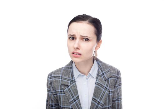 displeased businesswoman in office suit, close-up portrait, white studio background. High quality photo