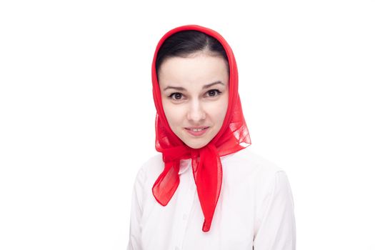 surprised woman in white clothes and a red scarf on her head, white background. High quality photo