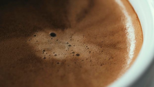 Close up Coffee froth on a hot coffee cup. Ready to drink hot cofffee