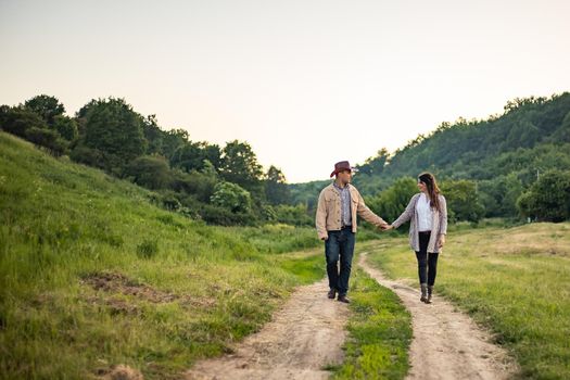 nice portrait of beautiful and young groom and bride outdoors