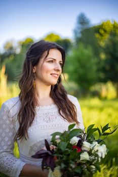 nice portrait of beautiful and young groom and bride outdoors