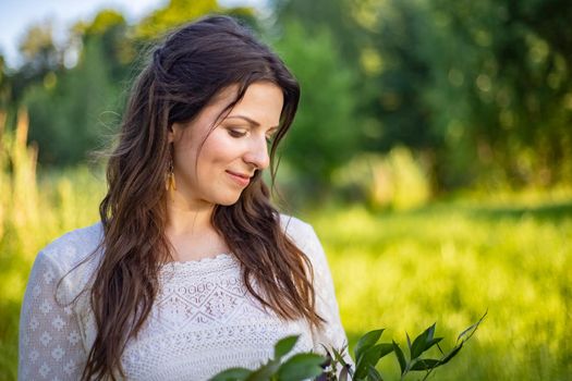 nice portrait of beautiful and young groom and bride outdoors