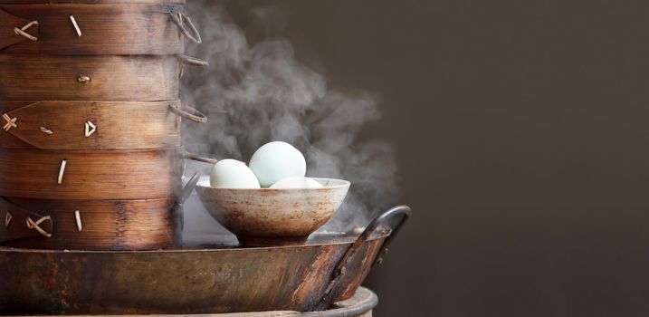 Chinese tea eggs and streamed dumpling in morning at retail outlet street food.