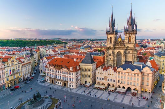 Top aerial view of Prague Old Town Square Stare Mesto historical city centre. Former market square. Stone Bell House, Gothic Church of Our Lady before Tyn, evening view. Bohemia, Czech Republic