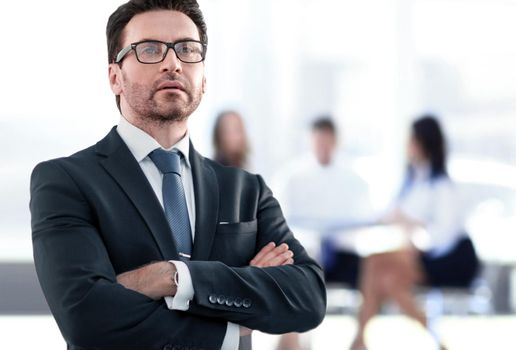 Businessman standing near the window and looking into it.photo with copy space