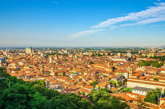 Aerial panoramic view of old historical city centre of Brescia city with churches, towers and medieval buildings with red tiled roofs, Lombardy, Northern Italy. Cityscape of Brescia town.