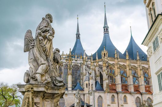 Saint Barbara's Cathedral Roman Catholic church Gothic style building and close-up baroque statues of saints in Kutna Hora historical Town Centre, Central Bohemian Region, Czech Republic