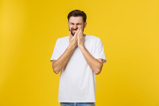 People, healthcare, dentistry and sickness concept. Depressed young unshaven man with painful stressed facial expression suffering from toothache