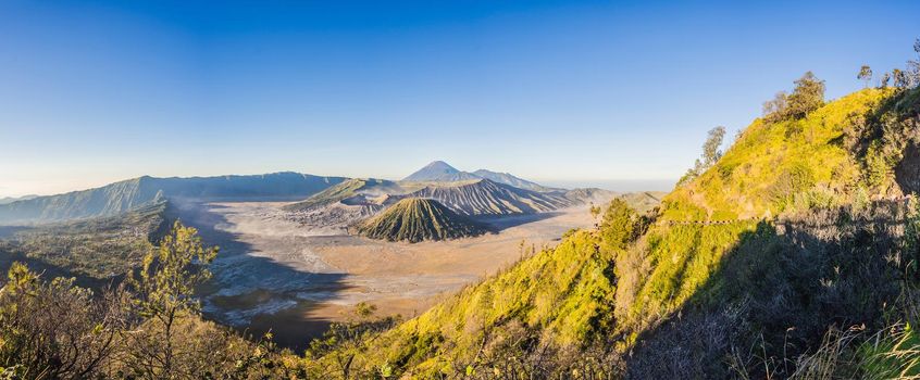 Sunrise at the Bromo Tengger Semeru National Park on the Java Island, Indonesia. View on the Bromo or Gunung Bromo on Indonesian, Semeru and other volcanoes located inside of the Sea of Sand within the Tengger Caldera. One of the most famous volcanic objects in the world. Travel to Indonesia concept.