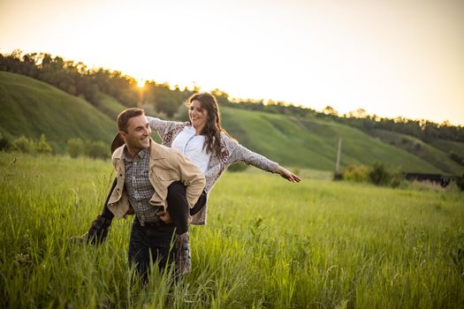 nice portrait of beautiful and young groom and bride outdoors