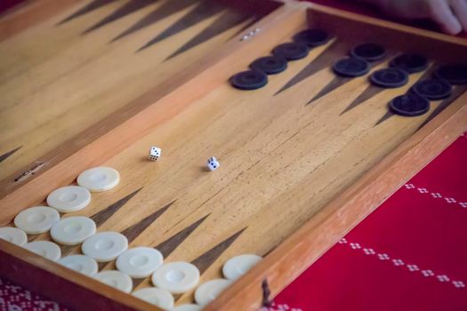 thrown dice on the table while playing backgammon