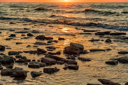 Beautiful background sea water with rocks during sunrise. Beautiful natural seascape