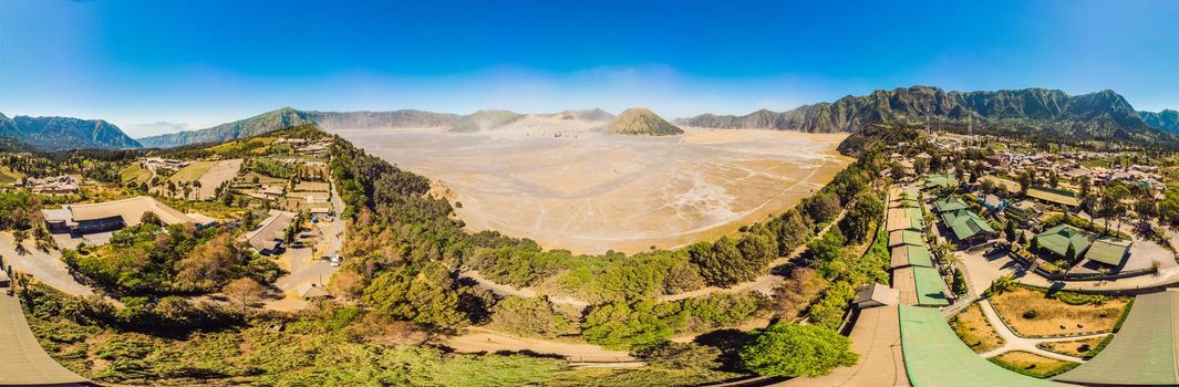 Panoramic Aerial shot of the Bromo volcano and Batok volcano at the Bromo Tengger Semeru National Park on Java Island, Indonesia. One of the most famous volcanic objects in the world. Travel to Indonesia concept.