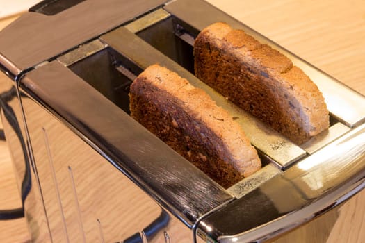 Toaster with toasted bread , Kitchen equipment. Top view.