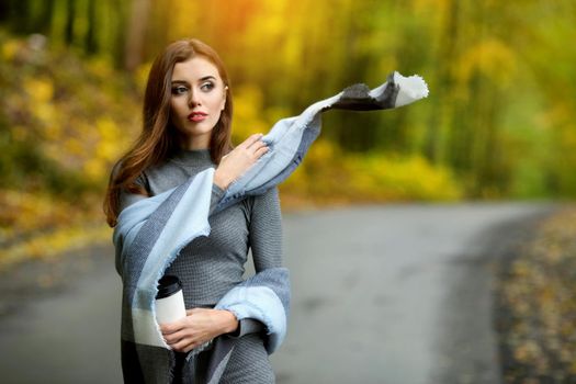 Autumn woman portrait smiling outdoors at the park