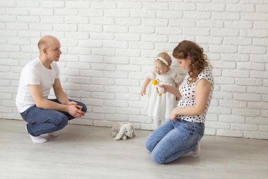 Mother holds her child with hearing aids and cochlear implants . Deaf and health