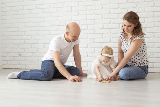 Mother holds her child with hearing aids and cochlear implants . Deaf and health