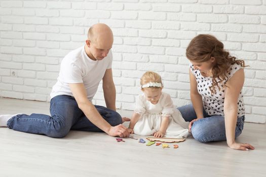 Mother holds her child with hearing aids and cochlear implants . Deaf and health