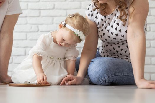 Mother holds her child with hearing aids and cochlear implants . Deaf and health