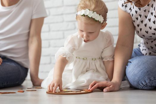 Mother holds her child with hearing aids and cochlear implants . Deaf and health