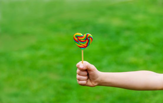 Lollipops in the hands of children. Selective focus. nature.