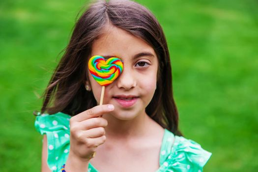 Lollipops in the hands of children. Selective focus. nature.