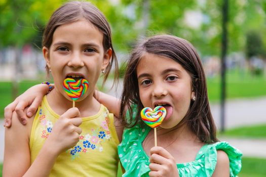 Lollipops in the hands of children. Selective focus. nature.